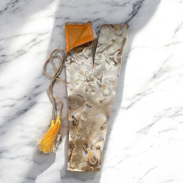 Katana Silk Bag in gold silk with dragon-cloud brocade pattern and gold tassel drawstring