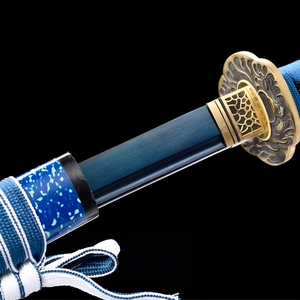 Kessho Sora Katana close-up showing blue Damascus blade with bo-hi, organic copper-brass cloud tsuba with koi openwork, honeycomb habaki, and turquoise cotton ito over genuine rayskin