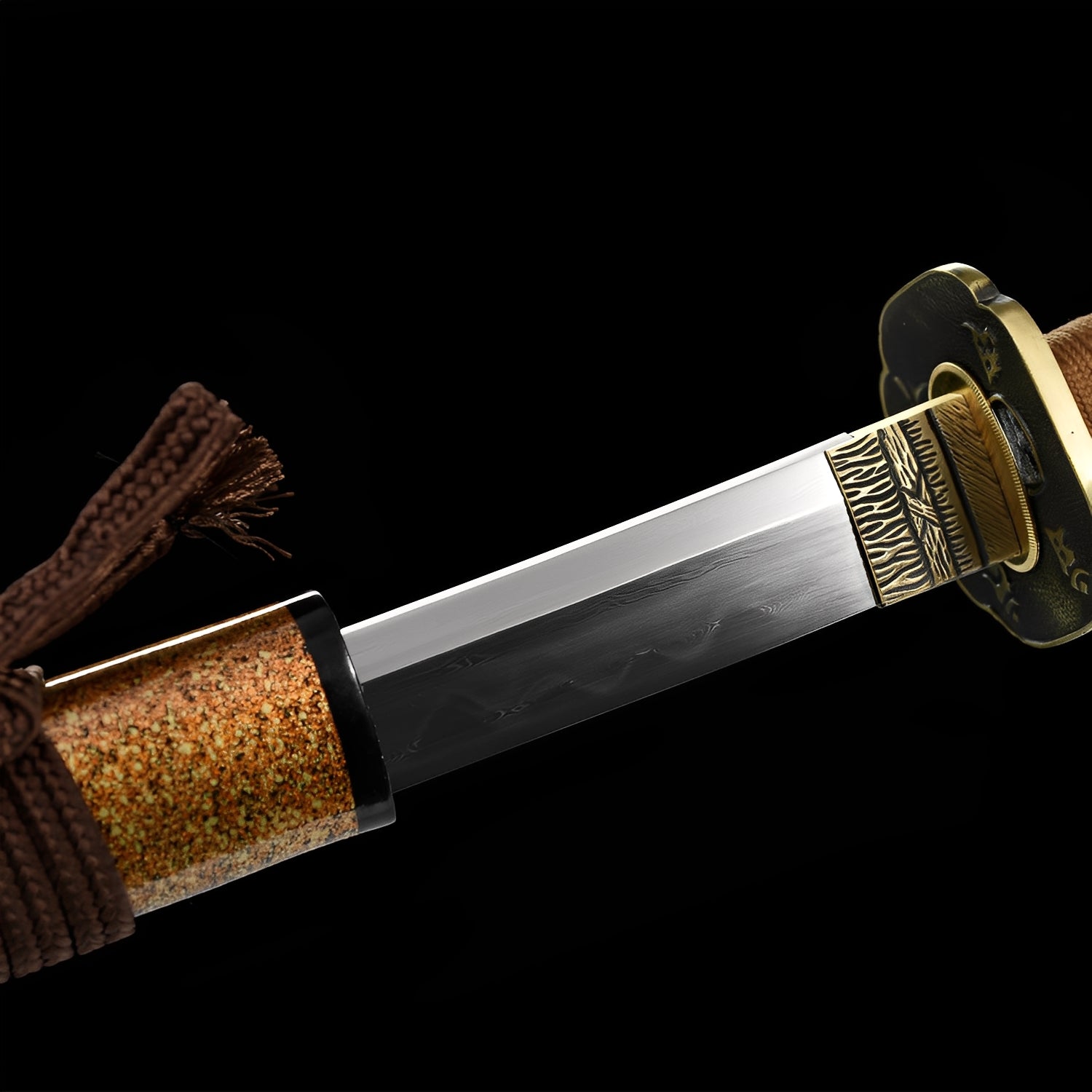 Kogarashi Katana close-up showing Damascus blade with authentic hamon, dual-tone copper tsuba with dragon-leaf openwork and brass rim, tiger-stripe habaki, and brown braided cotton ito over genuine rayskin