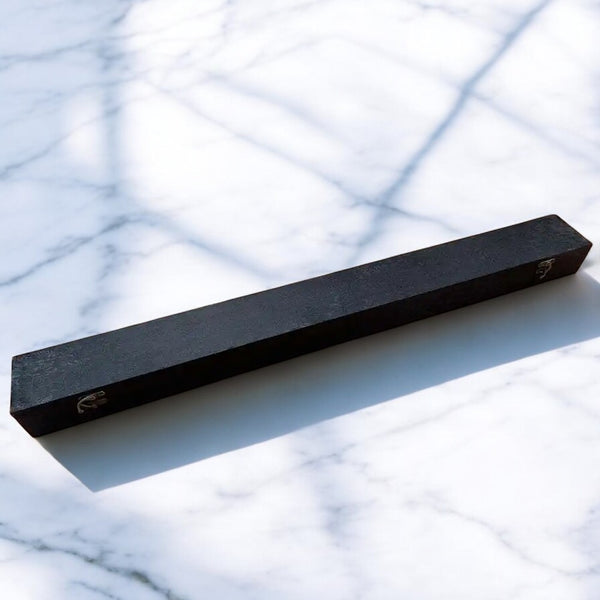 Premium Katana Box in black brocade fabric with subtle floral pattern and brass clasp hardware on marble surface