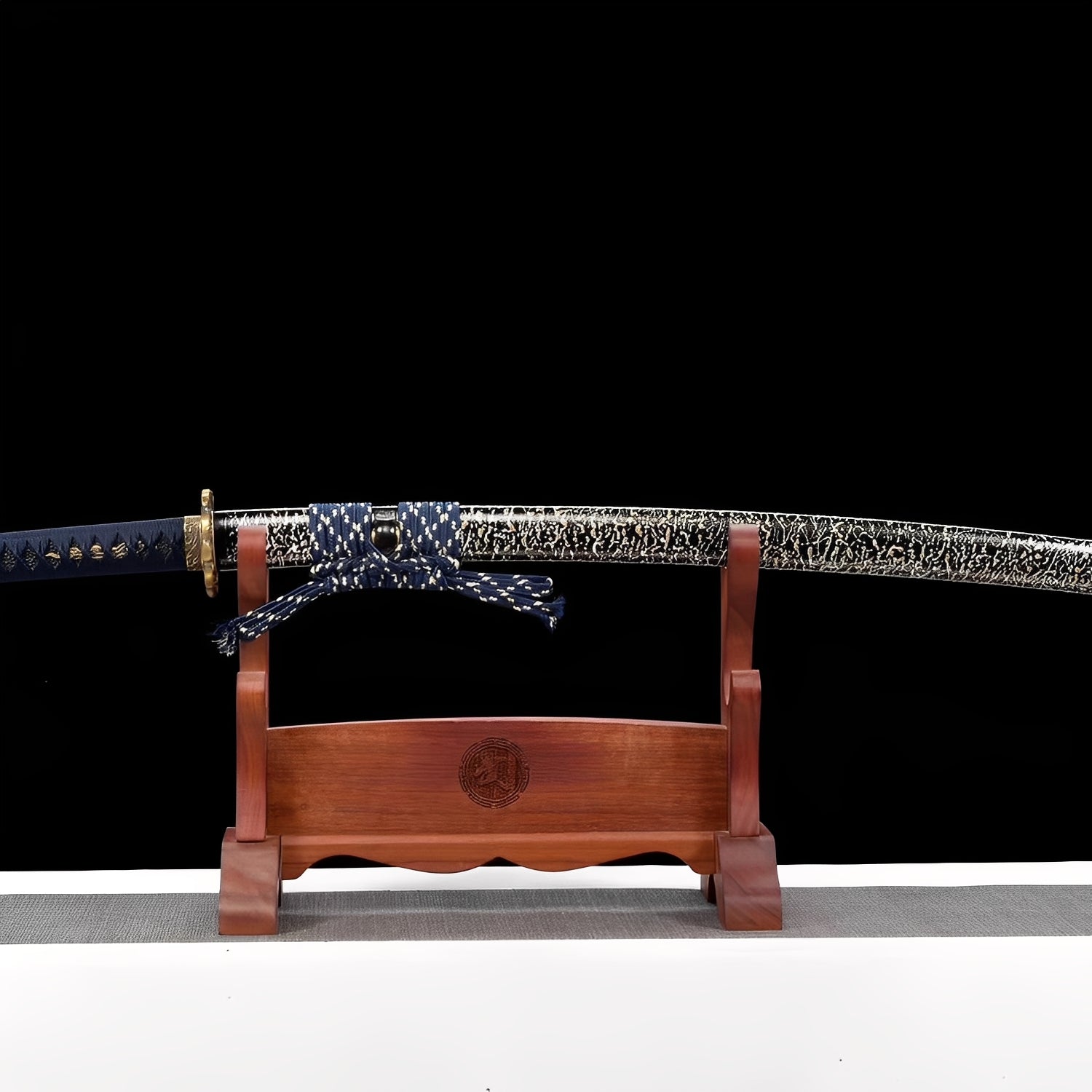 Shimokaminari katana saya detail showing dense white crackle-fracture network covering black lacquer surface