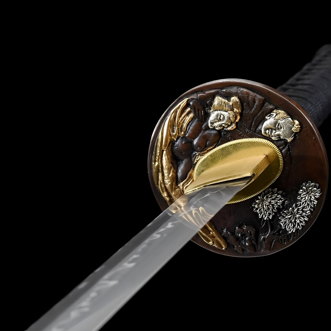 Gold-and-silver-plated relief details on the Ginto katana guard