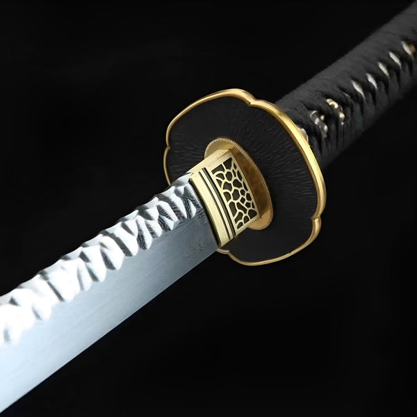 Hizakura katana blade detail showing prominent gunome-choji hamon temper line on Damascus steel