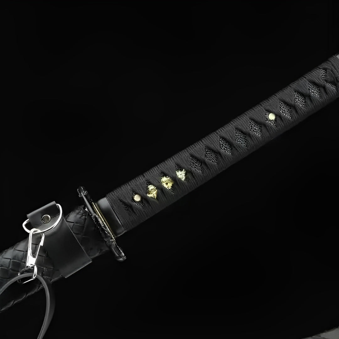 Black wrapping, metal ring and quilted saya on Kokuga