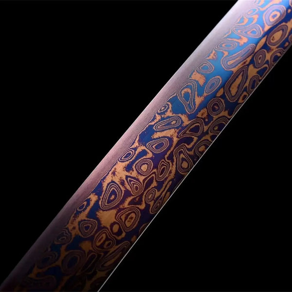 Mugengane katana full view on reddish wooden stand with purple Damascus blade transitioning from violet to rose, and gray-blue dragon saya