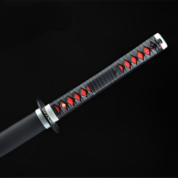 Nichirin katana handle detail showing black cotton ito wrap with red synthetic rayskin diamonds