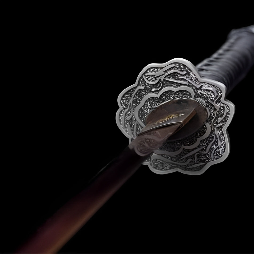 Sculpted metal guard on the Sekiro katana