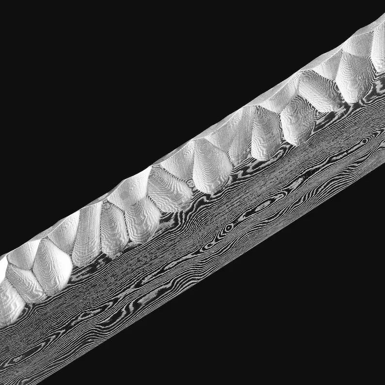 Shadow Moon katana blade detail showing Damascus wave pattern and tsuchime hammered spine texture on polished white steel