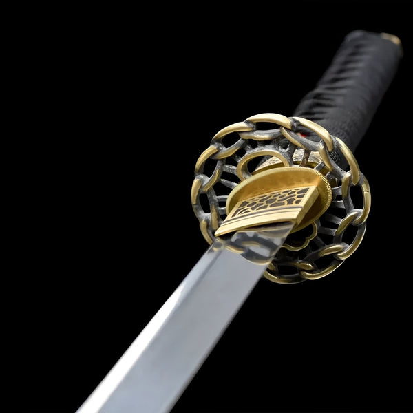Shinku wakizashi blade detail showing Damascus fold pattern on polished steel with red diamond ito visible at handle