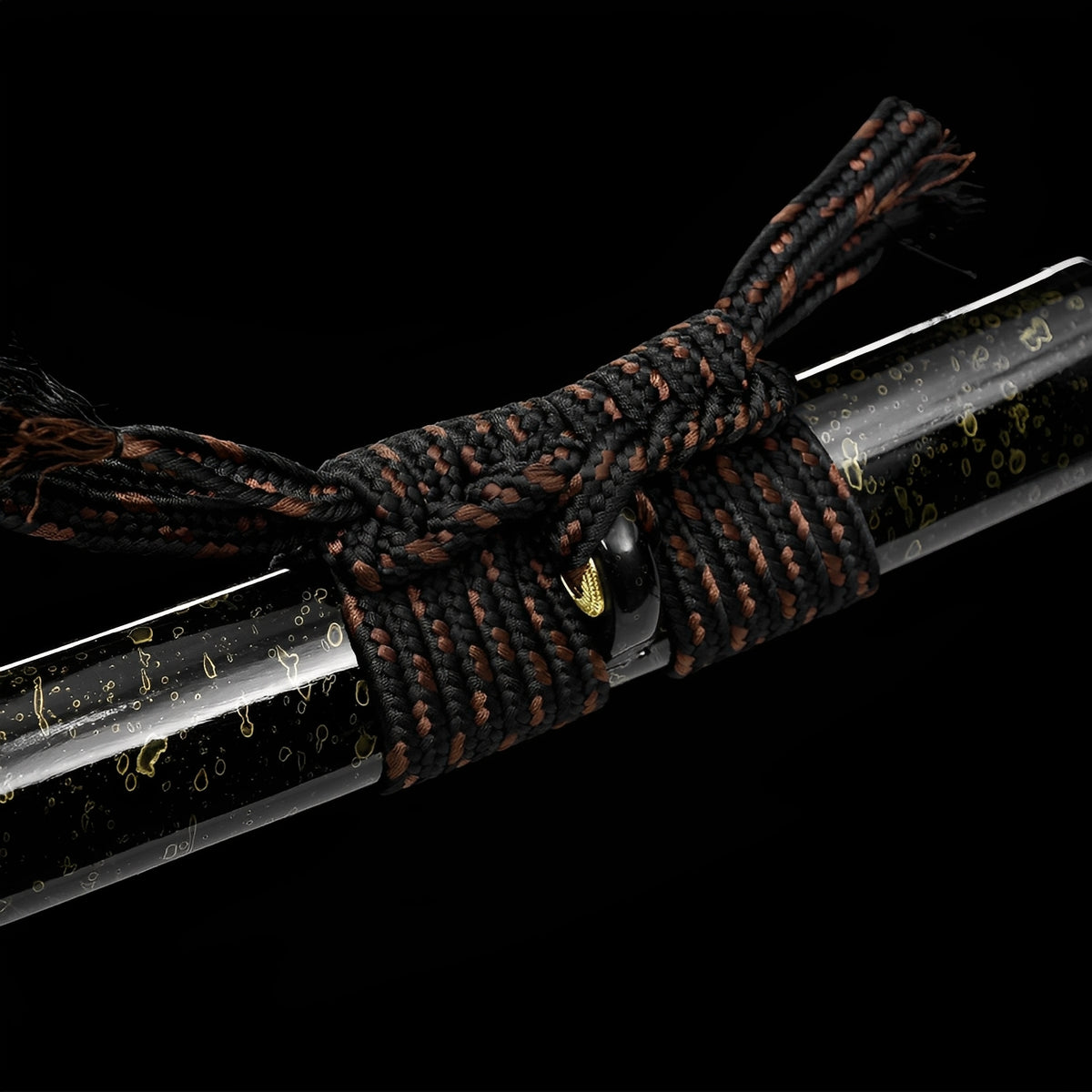 Golden details and black-and-brown cord on the Aurora saya