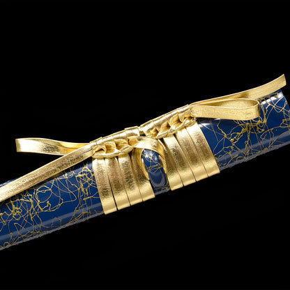 Aoi Seika katana saya detail showing gold kintsugi crackle veins spreading across deep navy blue lacquer surface with gold kojiri