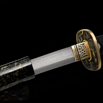 Aurora Katana close-up showing Damascus blade with subtle engravings, copper bamboo-relief tsuba with openwork, brass honeycomb habaki, and black ito over genuine rayskin
