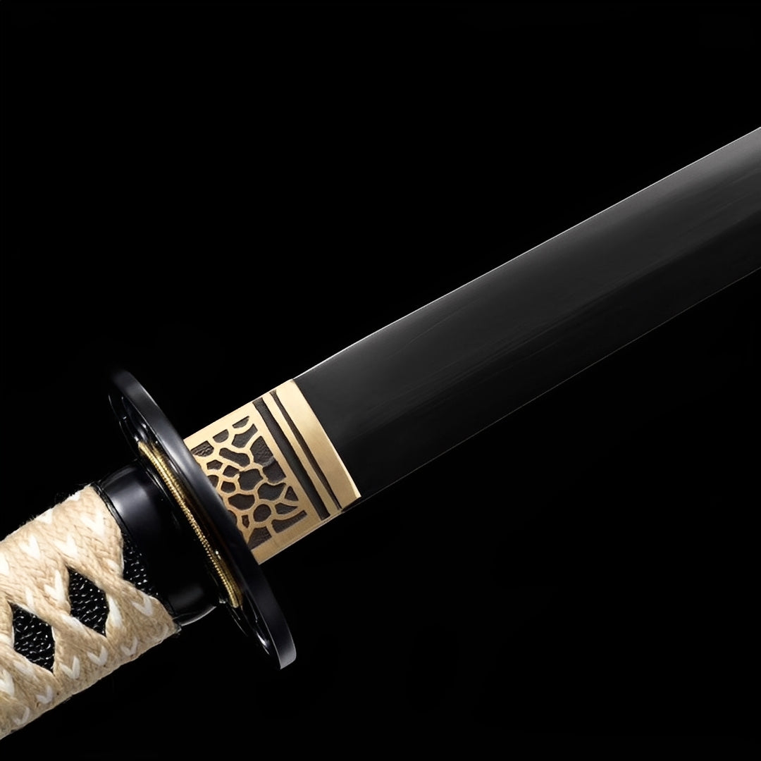 Obsidian Katana close-up showing matte black T10 blade, black glossy tsuba, bronze honeycomb openwork habaki, and cream cotton ito over black imitation rayskin