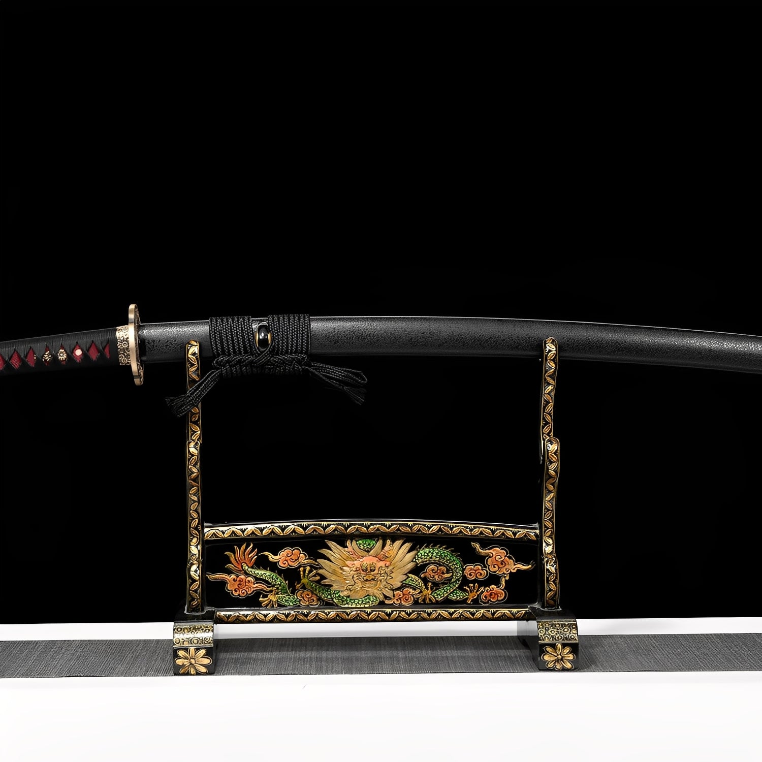 Crimson thunder katana complete set with black glossy saya, black-and-red handle, gold fittings, and black-gold display stand