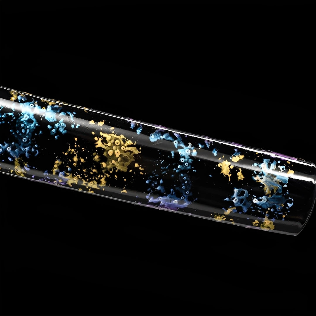Turquoise and gold flecks on the glossy black Starfall saya