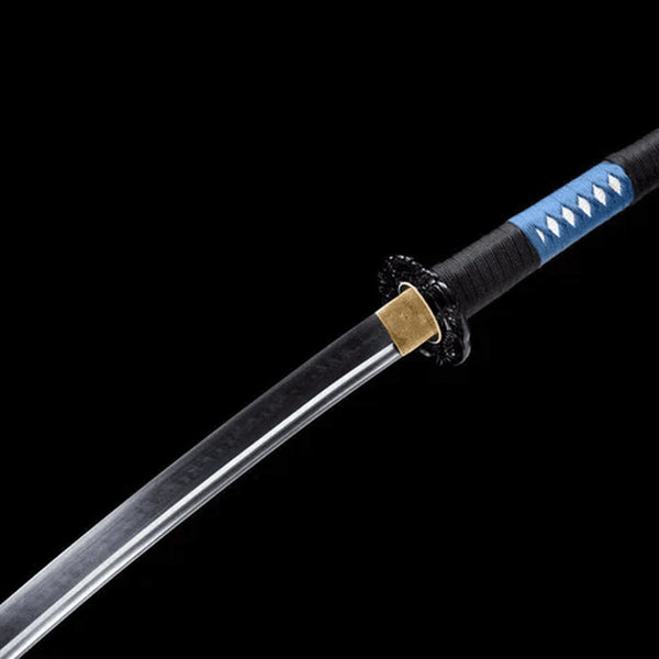 Deep Sea Fang katana blade detail showing midare hamon and dark dragon engravings on mirror-polished T10 steel