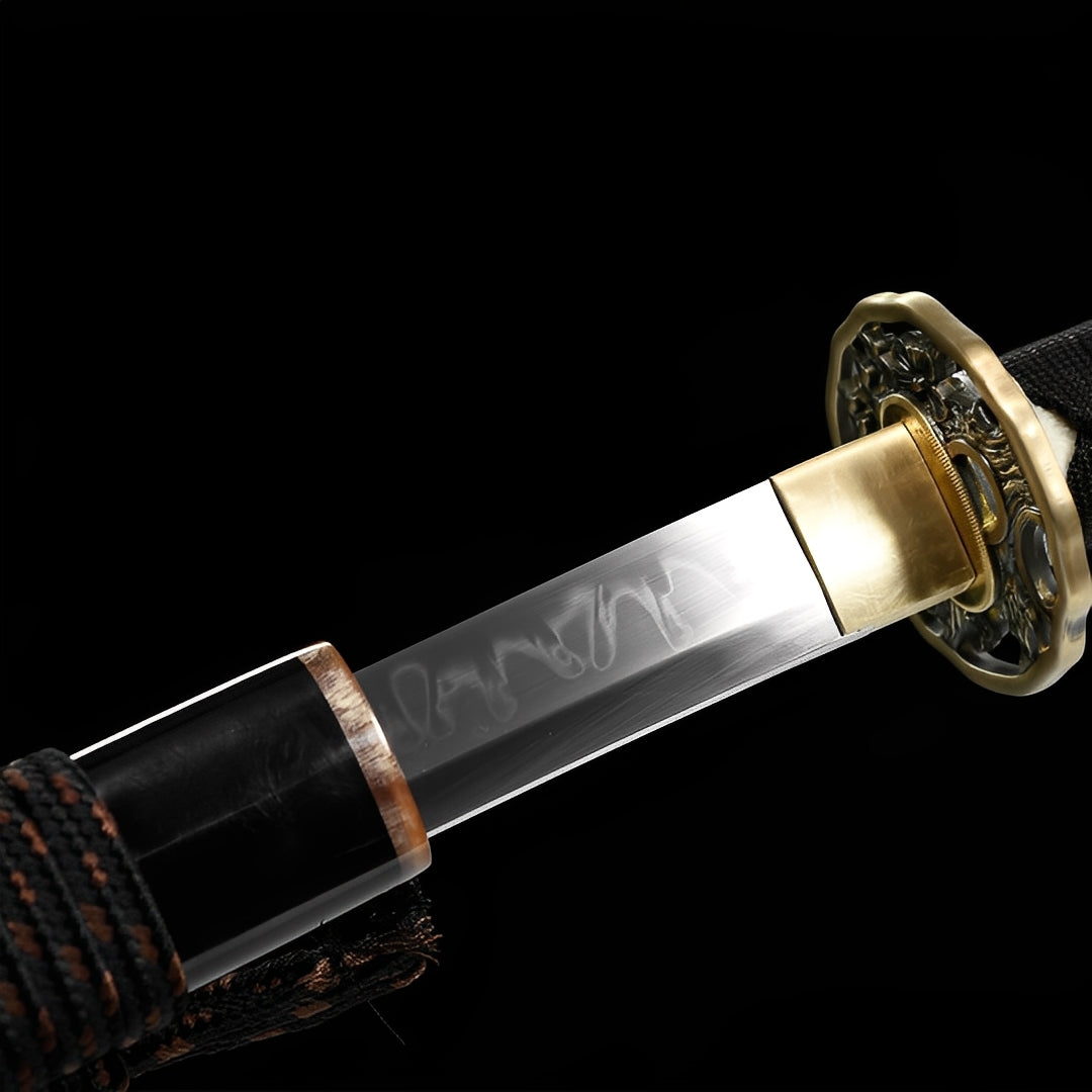 Imperial Katana close-up showing T10 blade with choji hamon and dragon engravings, copper-brass openwork tsuba with dragon relief, and black ito over genuine rayskin
