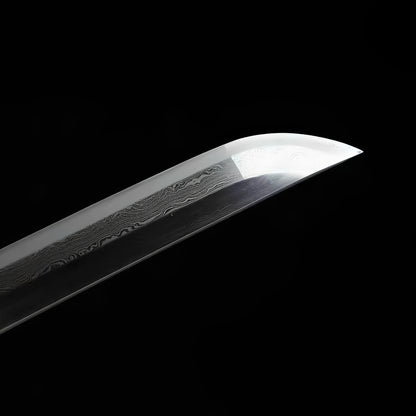 Kamakura katana blade detail showing layered Damascus folded grain running across entire polished surface