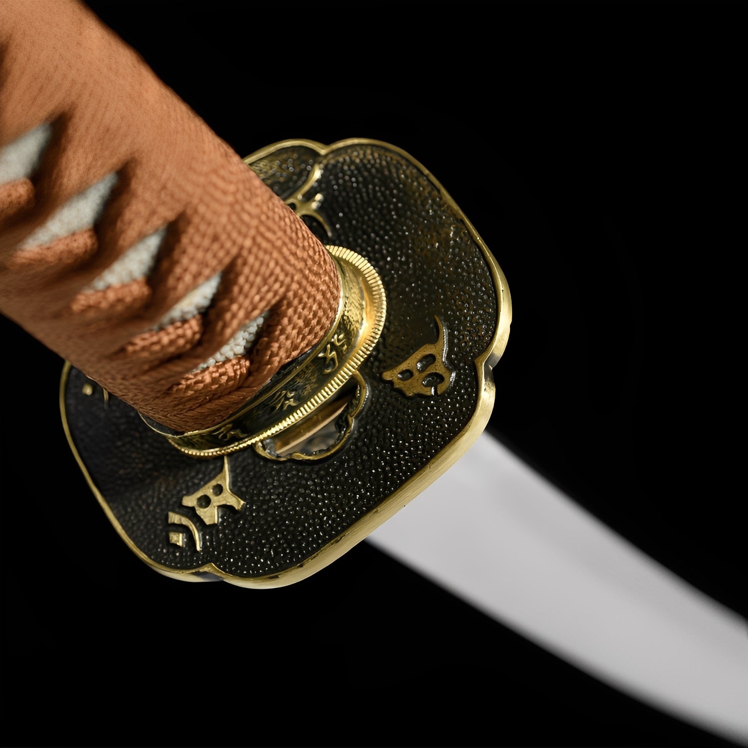 Kogarashi katana habaki detail showing brass with vertical tiger-stripe texture pattern and gold band accents