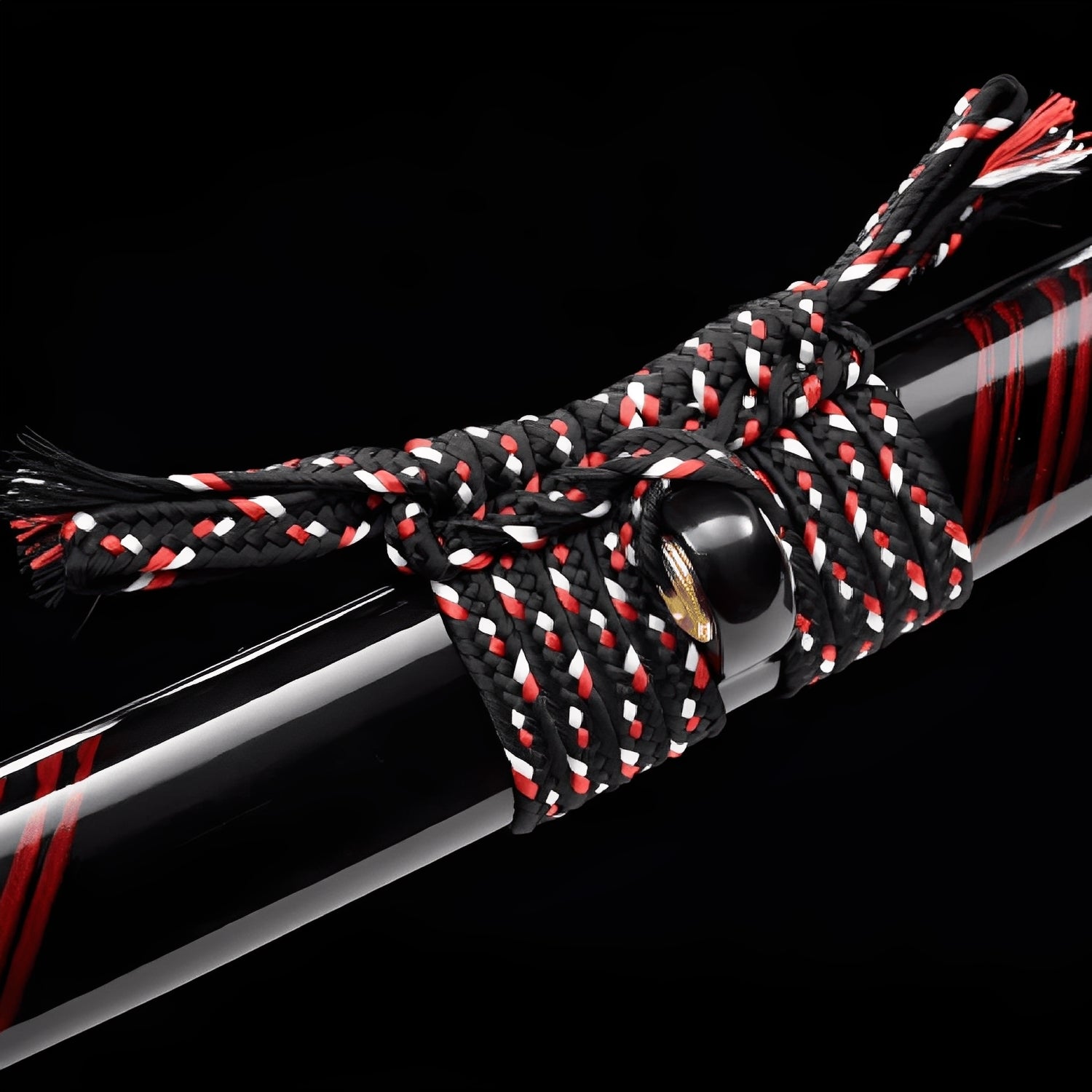 Kurenai Kage katana saya detail showing three deep red diagonal slashes across glossy black lacquer surface