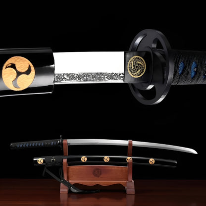 Mitsudomoe katana full view on natural wood stand with glossy black saya displaying four gold mitsudomoe brass emblems at regular intervals
