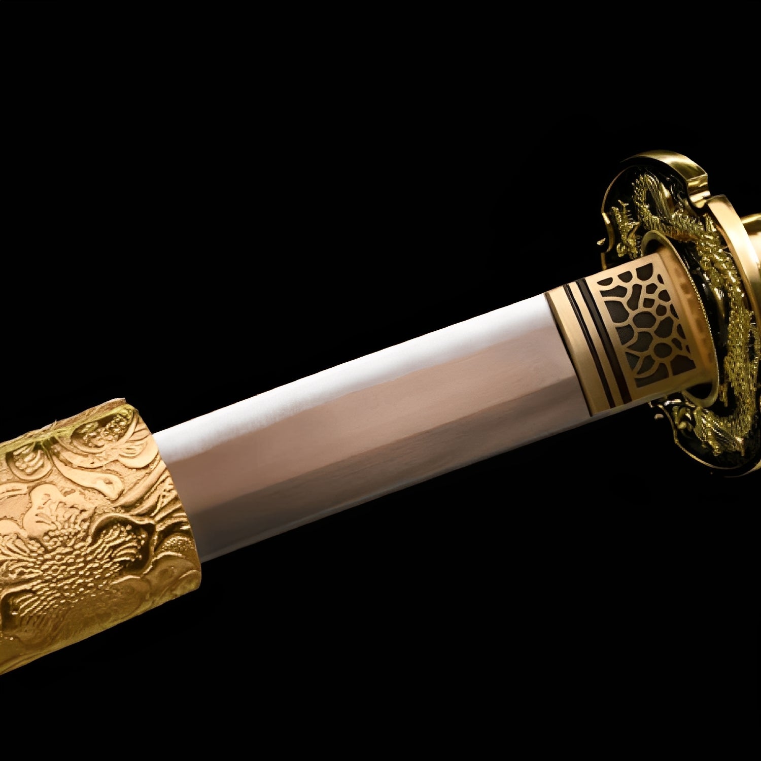 Ogon Ryushi Katana close-up showing gold manganese blade, gold zinc-alloy dragon openwork tsuba with individually carved scales, brass honeycomb habaki with gold bands, and gold synthetic leather ito over white synthetic rayskin