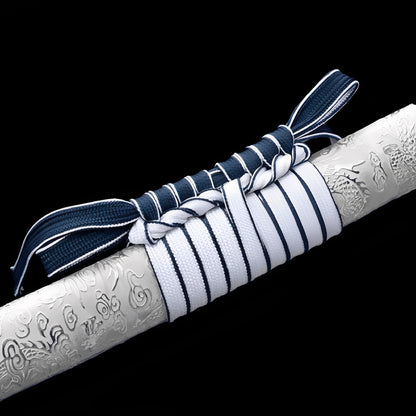 Seiryu Enbu katana saya detail showing white flame-wave motifs rising against deep navy blue lacquer surface