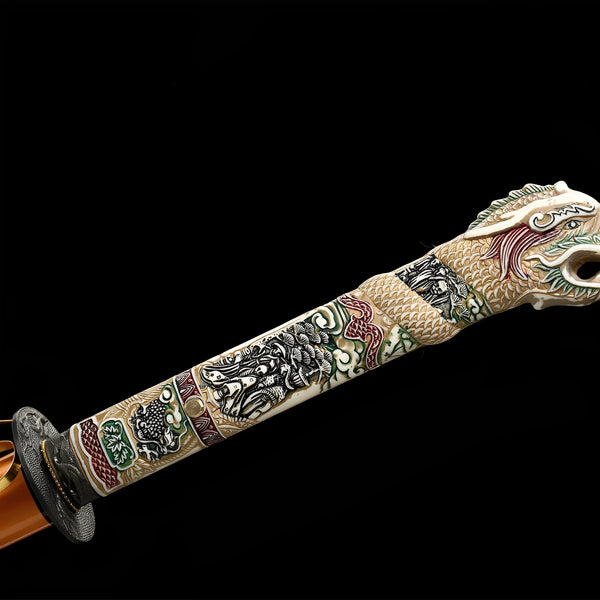 Tentai Drake katana handle detail showing hard ABS sculpted grip with red-green-cream mythological panels and dragon-head kashira