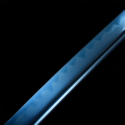 Azure Spirit katana blade detail showing mirror-polished blue 1095 steel with clay-tempered hamon visible beneath blue finish