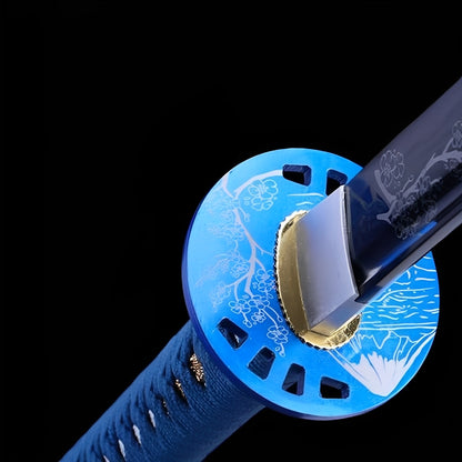 Blue Sakura katana saya detail showing white cherry blossom branch engravings on glossy azure blue lacquer