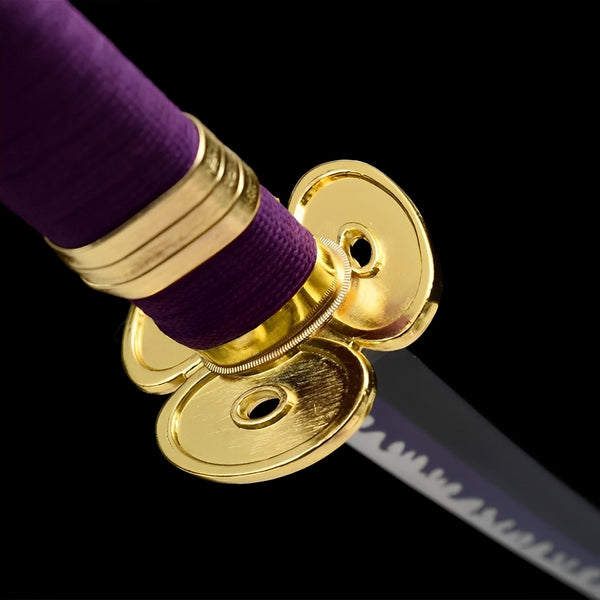 Enma sword gold trefoil tsuba and purple cotton handle close-up