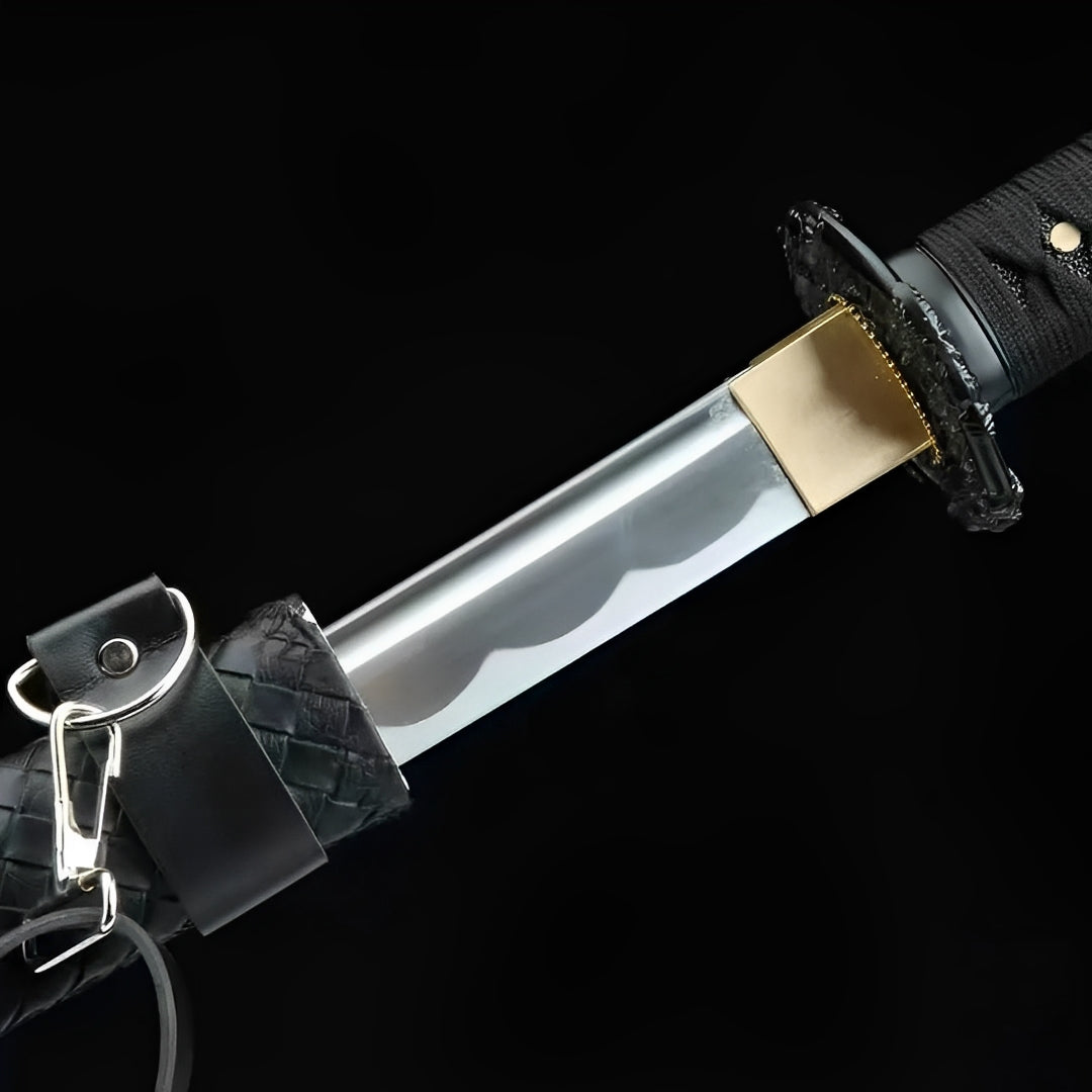 Kokuga polished blade beside its black guard and textured saya