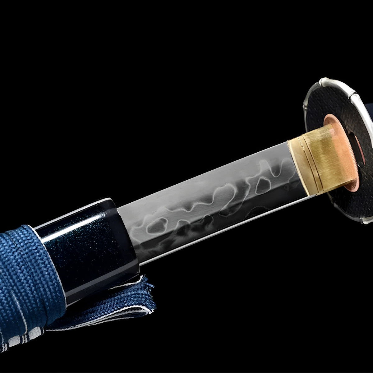 Kumo katana showing its polished blade and navy scabbard opening