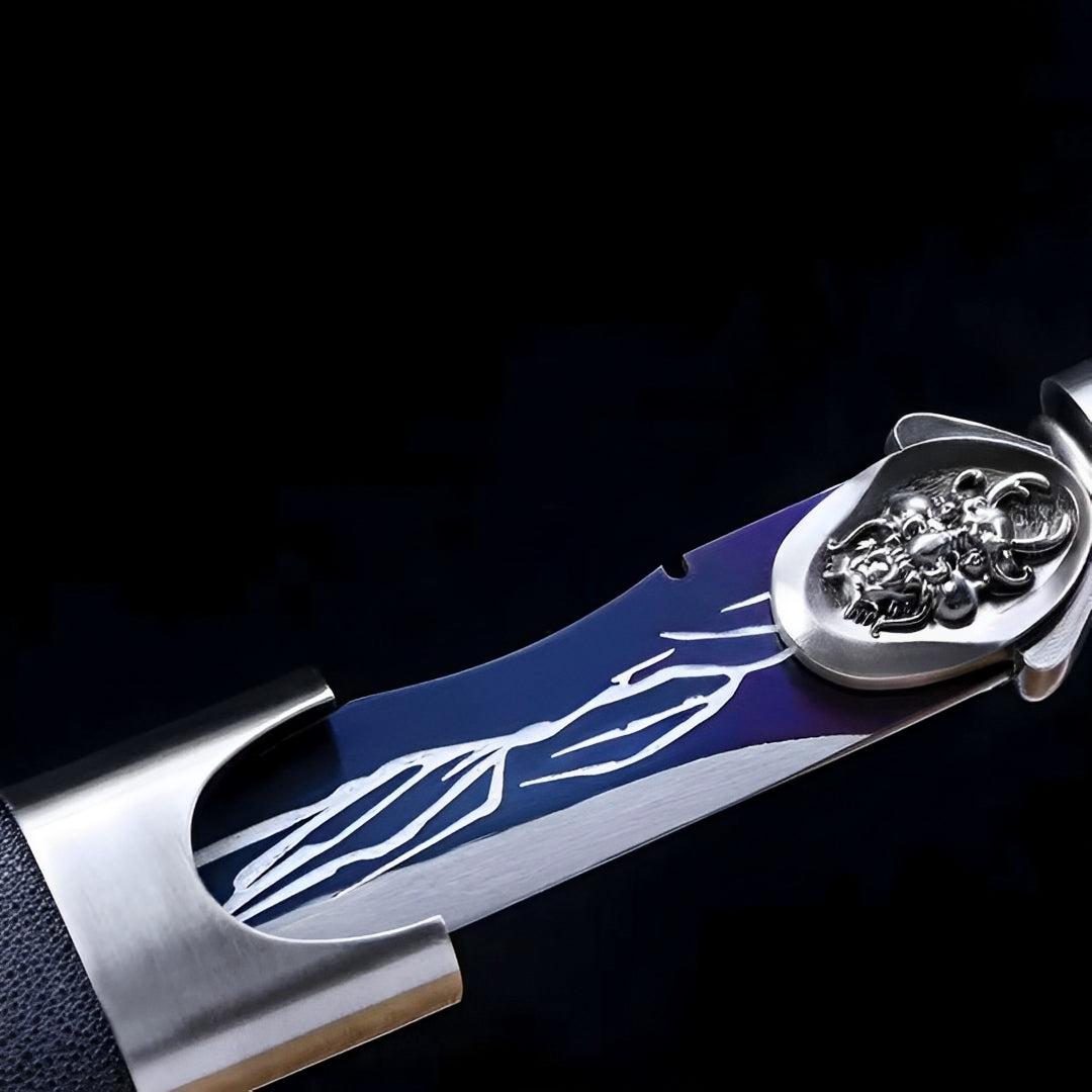 Silver-colored sculpted guard beside the blue-violet Raisenga blade