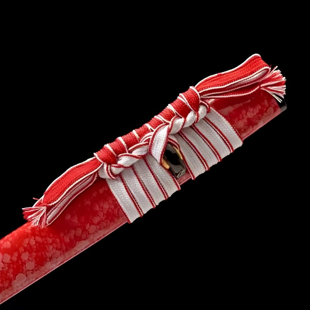 White cord tied around the textured red scabbard of the Red Blade katana