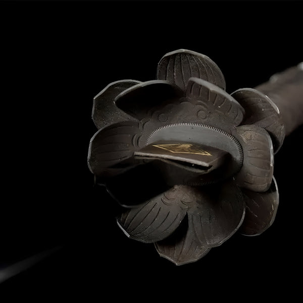 Sekiro Death Blade katana detail showing copper lotus flower tsuba in three-dimensional petal form