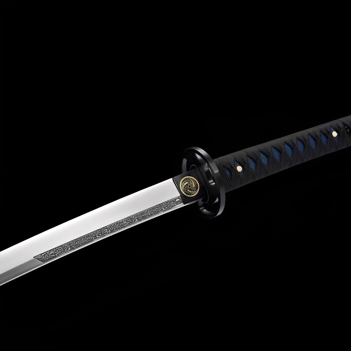 Mitsudomoe silver blade with scroll decoration beside its black handle
