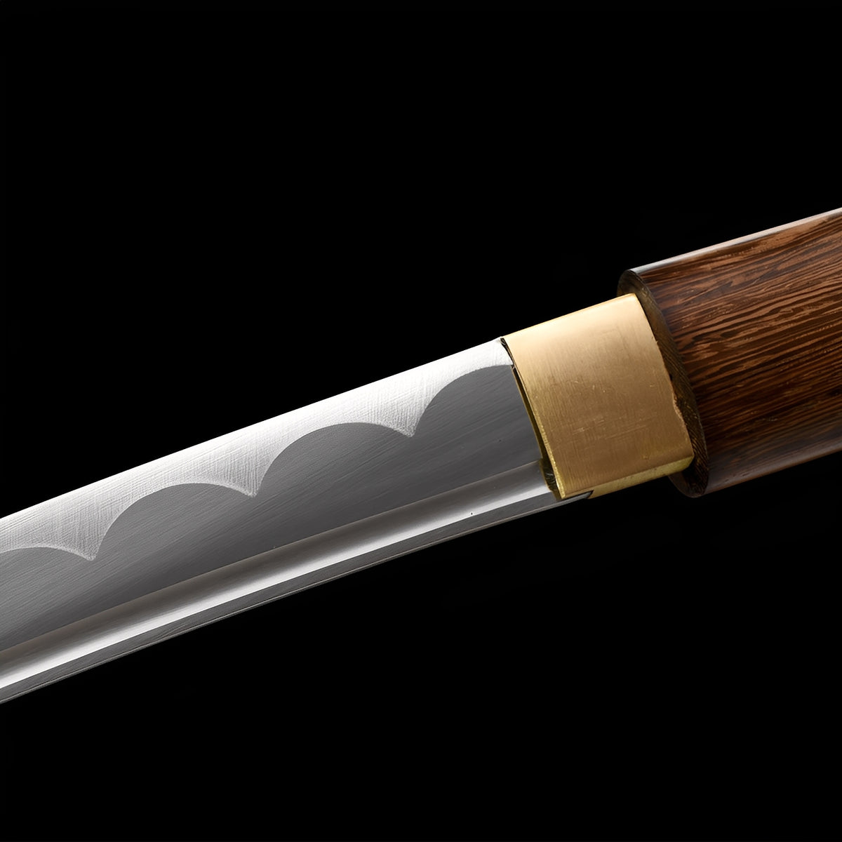 Scalloped decorative hamon beside the brass Mokuro Kageuchi collar