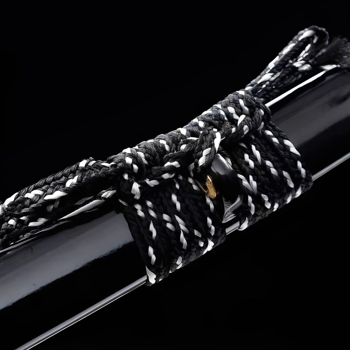 Black-and-white twisted cord on the glossy black Kamakura saya