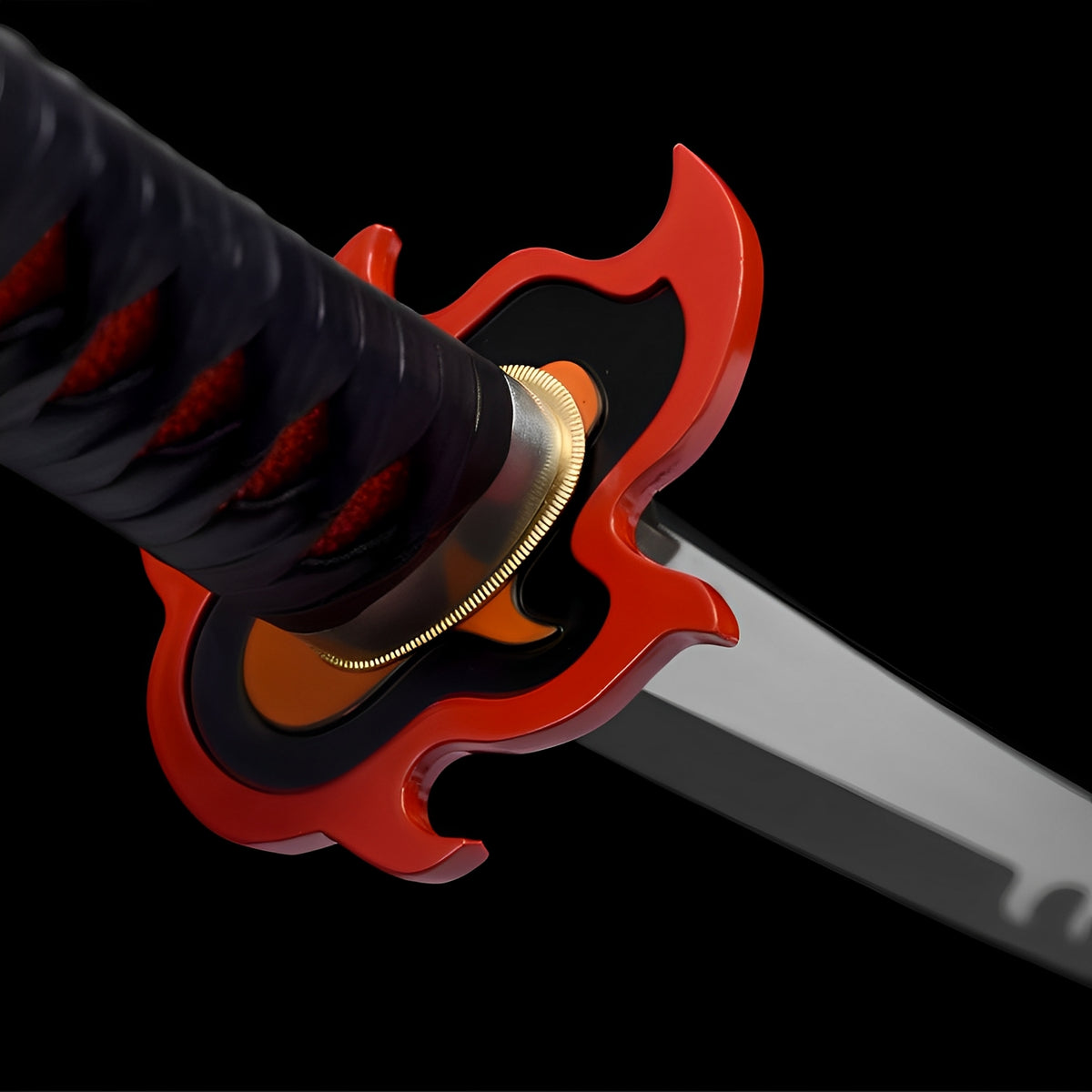 Close-up of the Tanjiro katana red flame-shaped guard and black handle