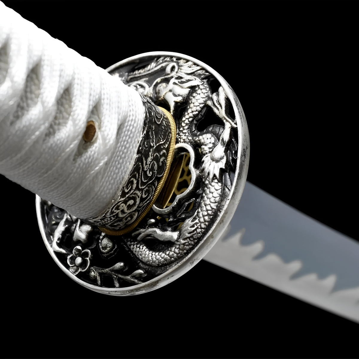 White cotton handle and floral guard with silver rim on the White katana